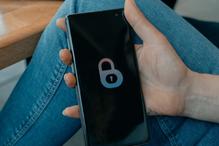 Black and white smartphone in the person's hand